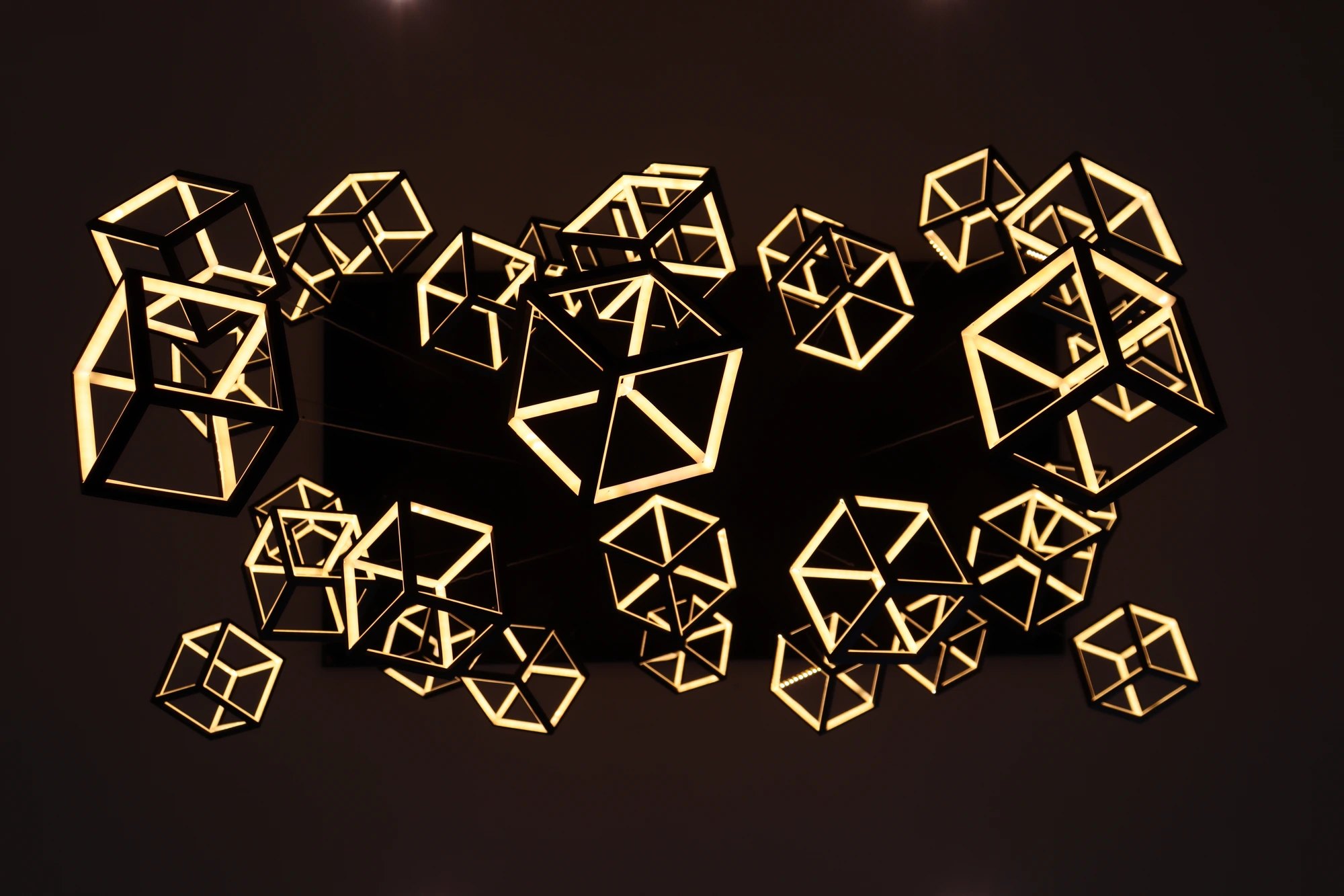Azure Cove — illuminated geometric light installation at night